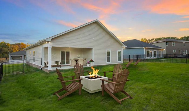 Spacious backyard with large firepit